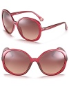 Round oversized sunglassses with red transparent frames for a sizzling style.