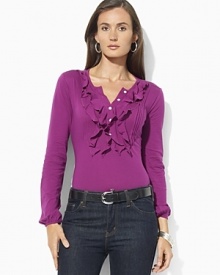 A long-sleeved cotton tee is accented with delicate ruffles at the placket for a feminine twist on a classic.