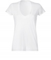 Stylish T-shirt in white cotton - Super-soft, machine washable material - Flattering low V-neck with decorative trim - Relaxed slim cut with tight short sleeves - Hits at hip - A genius basic ideal for layering beneath blazers and cardigans - Pair with denim or leather slim pants and style with scarves or colorful multi-strand necklaces