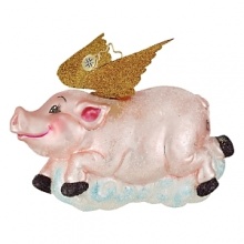 A happy pig with gold glittering wings flies over a puffy cloud.