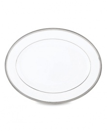 Metropolitan sensibility and modern design combine in this understated white bone china platter from Lenox's collection of dinnerware and dishes. Platinum gild along the edge is enhanced by a clean, platinum geometric pattern reminiscent of architectural accents. Qualifies for Rebate