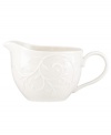 With an elegant white-on-white pattern featuring an embossed vine motif and radiant glaze, the Opal Innocence Carved gravy boat gets your table set for refined dining every day. Qualifies for Rebate