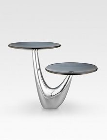 As eye-catching as the cakes and tarts it's designed to support, this two-tier server creates its own spotlight on any table. Handcrafted with glass platforms and a curved, lustrous alloy base. 12H X 15 diam. Hand wash Imported