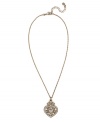 Give her your heart with this intricate style. Monet's beautifully-crafted heart pendant features a mixed metal setting with gold tone mixed metal accents and sparkling crystals. Approximate length: 16 inches + 2-inch extender. Approximate drop: 1-1/4 inches.