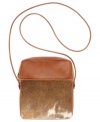 Take on the season's top trend with this haircalf design from Patricia Nash. Rich tan leather, hand-crafted stitching and antiqued brass hardware lend a luxe southwest appeal, while the convenient crossbody strap offers effortless versatility.