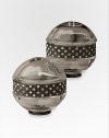 A pair of richly detailed platinum salt and pepper shakers are hand-embellished with faceted Swarovski crystals that add a jeweled touch to any table. From the Noir Collection Hand wipe Imported