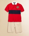 A short-sleeved rugby shirt is crafted from breathable cotton mesh with a contrast stripe and a preppy, nautical-inspired patch.Solid twill collarShort sleeves with ribbed armbandsButton frontEven vented hemCottonMachine washImported Please note: Number of buttons may vary depending on size ordered. 