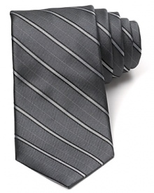 An immaculate silk tie with a classic pinstripe pattern from Michael Kors brings a bit of panache to your office attire.