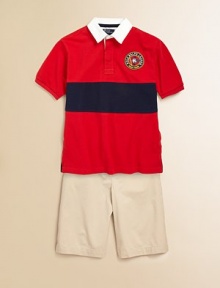 A short-sleeved rugby shirt is crafted from breathable cotton mesh with a contrast stripe and a preppy, nautical-inspired patch.Solid twill collarShort sleeves with ribbed armbandsButton frontEven vented hemCottonMachine washImported Please note: Number of buttons may vary depending on size ordered. 