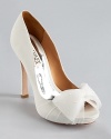 A beaded organza bow decorates the front of Badgley Mischka's Zali pumps--the perfect shoe for the bride-to-be.