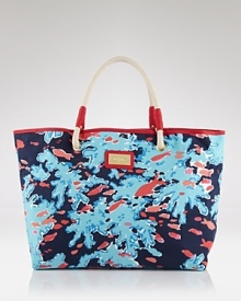 Lilly Pulitzer's rope-handle tote is a preppy staple. Decked in the Palm Beach dame's bold coral print, this bag is a perfect partner to your boat shoes and pearls.