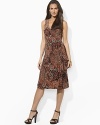 Smooth paisley printed jersey flatters the body in a feminine A-line silhouette with an elegant cross-wrap neckline.