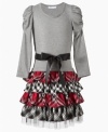 Fashion forward. Traditional plaid accents this tiered-skirt dress from Bonnie Jean to help her shake up the scene.