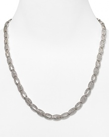 Shape meets sparkle on this silvery link necklace from Lora Paolo, featuring inset crystals and a delicate oval design. It's classic lines make it an elegant accessory for evening.