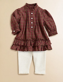 An adorable cotton plaid top adorned with ruffle trim is paired with essential leggings for an unbeatable match. Tunic Ruffled stand collarLong sleeves with ruffle-trimmed barrel cuffsButton-frontRuffled hemLeggings Elastic waistbandScalloped hemCottonMachine washImported Please note: Number of buttons may vary depending on size ordered. 