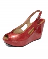 Shoes make the look. Go for bold with the metallic sheen of the lizard print Soley U wedges by Kenneth Cole Reaction.