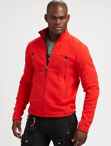 A sleek fleece full-zip jacket, crafted for comfort and style, features oversized pockets at the chest for your on-the-go storage needs.Zip frontStand collarZippered chest pocketsPolyesterMachine washImported