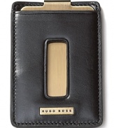 Wrought in quality burnished leather and brushed steel, this slim money clip features a logo plaque on the front and a clip on the back.