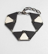 From the Facet Collection. Inspired by the mathematical genius of graphic artist M.C. Escher, this simple, strong linked triangle bracelet makes a striking statement.Powder-coated and antiqued brass and pewterLength, about 6-8 (adjustable)Lobster claspMade in USA