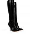 Exquisitely styled with a sleek, streamlined finish, Givenchys jet back tall leather boots guarantee a flawless polish to your look - Softly pointed toe, hidden inside zip, stiletto heel with metal insert - Pair with tailored sheaths and ultra luxe outerwear