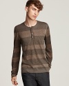 The John Varvatos sweater rolls out the stripes in a muted reverse print.