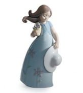 Little Violet wears a flower-print dress to match her basket of blooms in this darling collectible, handcrafted in Lladro porcelain.