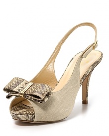 Snake embossed accents lend an exotic air to a slingback sandal in natural linen. From kate spade new york.