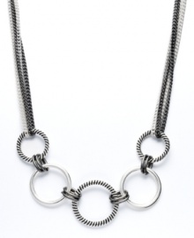 The key to good style is all in the accessories. This chic necklace by Alfani will add just the right extra touch. Interlocking circles come together in a fun frontal design. Crafted in silver tone and hematite tone mixed metal. Approximate length: 18 inches + 2-inch extender.