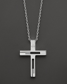 Sterling silver forms an elegant cross pendant.