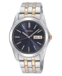 Keeping time around the world. This Seiko watch features a goldtone and silvertone stainless steel bracelet and round case. Blue dial with goldtone stick indices, logo and date window with English and Spanish display. Quartz movement. Water resistant to 30 meters. Three-year limited warranty.