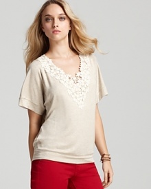 A soft terry Red Haute top with lace appliqué at the neckline flaunts feminine flair, lending a trend-right touch to cool colored denim for a season of sensational looks.