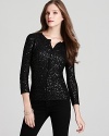 Throw on this shimmering sequined C by Bloomingdale's cardigan for a glamorous quick-fix any day of the week.