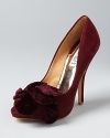 Sophisticated velvet bows add polished style to these soft, suede Badgley Mischka evening pumps.