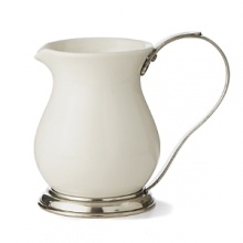 This revolutionary collection combines white ceramic with hand-finished pewter trim, creating a stunning marriage of light and shadow. The entire collection is dishwasher safe.