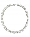 Simply stunning. Add glitz and glamour to your evening look with this chic collar necklace from Monet. Featuring a sparkling array of Swarovski crystals, it's crafted in silver tone mixed metal. Approximate length: 18 inches.