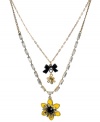 The essence of spring. Betsey Johnson's bumblebee-colored pendant features yellow and black enamel accents, baguette crystals, and a black bow and crystals. Two row design set in gold tone mixed metal. Approximate length: 16 inches + 3-inch extender. Approximate drop: 1-1/2 inches.