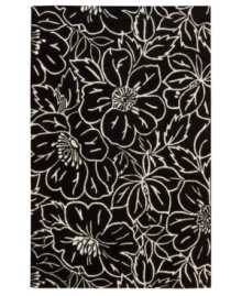 Striking ivory outlines render a high-style floral motif that pops against a jet-black ground. This Nourison rug is hand-tufted from premium-quality wool and meticulously hand-carved for a lush dimensional effect, every detail coming together to create a bold focal point in any setting. (Clearance)