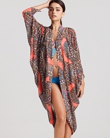 Palm Springs perfection. This vintage-inspired stunner falls in flattering drapes over swimsuits--and makes an elegant after-hours throw with an LBD. By Mara Hoffman