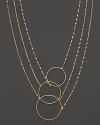 Interlocking circles and gleaming chains of 14K yellow gold. By Lana.