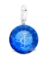 Juicy Couture's stunning charm features a round-cut solitaire blue epoxy stone engraved with logo detail. Set in a four prong silver tone brass setting. Lobster clasp closure. Approximate drop: 2 inches.