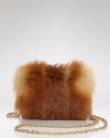 Let the fur fly with this crossbody bag from Z Spoke Zac Posen. In perfect step with this season's tufted trend, it boasts a chic shape and delicate metallic chain strap for evening ease.