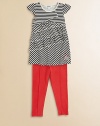 Playful with a touch of chic, this undeniably cute combo sports horizontal and diagonal stripes, tiered ruffles and colorful matching leggings. Tunic Jewel necklineCap sleevesAsymmetrical tiered ruffles Leggings Elastic waistbandPull-on styleFront seams57% cotton/38% polyester/5% spandexMachine washImported