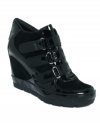 Pump up your kick collection with Rocket Dog's Redell wedge sneakers. They feature a Velcro vamp and hidden wedge heel.