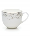 Fringed with shimmering leaves of platinum and mica, this bone china teacup turns your table into a springtime utopia. Its sleek coupe shape is a vision of modern elegance in platinum-banded white.