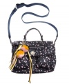 This playful design from Teen Vogue will have you seeing stars. An on-the-go messenger silhouette is covered with an all-over star pattern and fun bow and pom-pom charms at handle base.