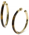 Retro chic. These Michael Kors hoop earrings feature an trendy blend of tortoise acetate and gold tone steel. Approximate length: 2-1/2 inches.