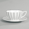 Jasper Conran continues to close the gap between formal dining and casual living. He accents the contemporary beauty of his already popular white bone china range with a touch of formality in the forum of a thin platinum band. To create an interplay of proportions, accent pieces including a plate, a charger, a small pitcher, mug, teacup and saucer, use thick platinum stripes to reinforce the pattern's look of sophisticated elegance.