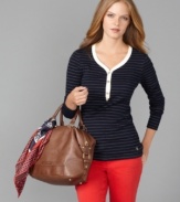 The classic henley shirt gets dressed up with thin metallic stripes and goldtone buttons in this Tommy Hilfiger look.