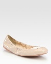 Patent leather scrunch ballet flats with criss-cross elastic detail. Patent leather upperLeather liningRubber solePadded insoleImportedOUR FIT MODEL RECOMMENDS ordering one half size up as this style runs small. 