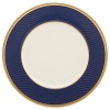 Inspired by privately commissioned presidential dinnerware, this fine china features stately navy bands and a gold border etched with patriotic stars.